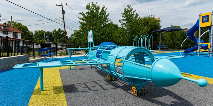 Playground with turquoise blue custom airplane climber 