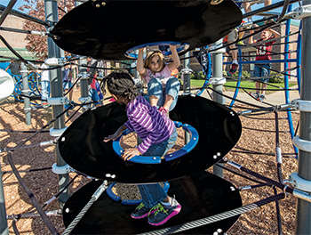 A disc net climber provides many benefits of play for children