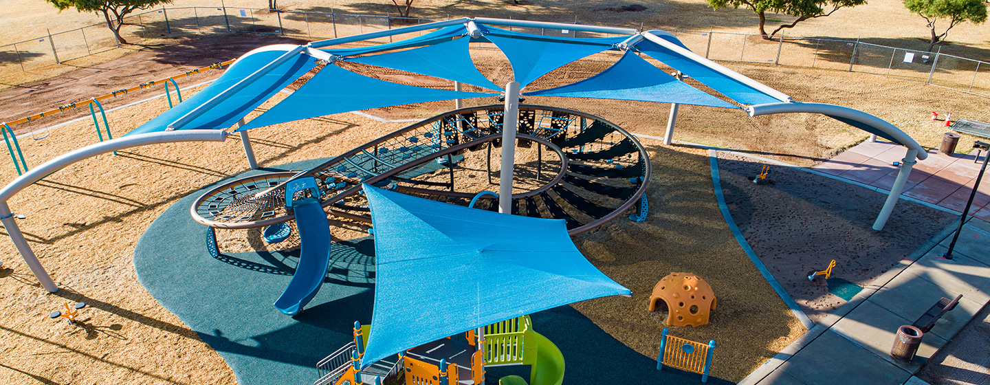 Blue SkyWays shade structures hover over a massive figure-eight shaped Quantis netplay structure.