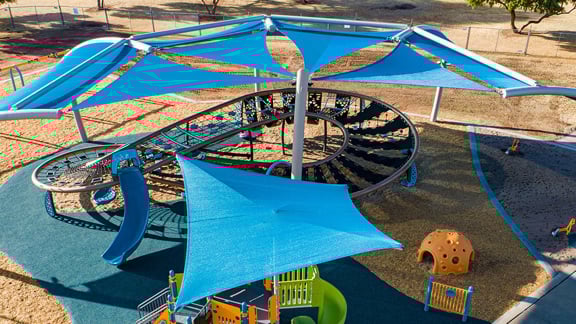 Blue SkyWays shade structures hover over a massive figure-eight shaped Quantis netplay structure.